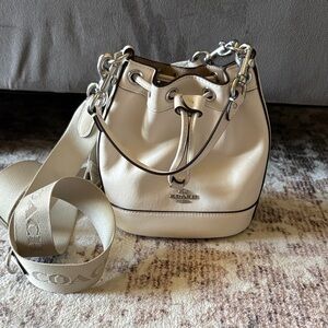 Coach Cream Pebbled Leather Drawstring Bucket Bag with Logo Strap